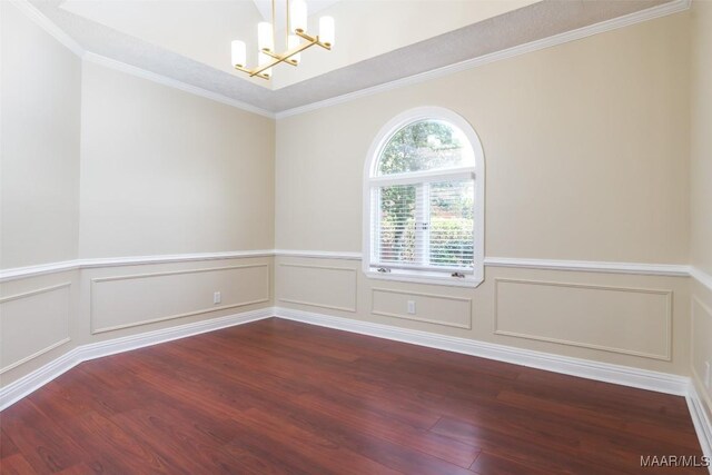 2224 Halcyon Blvd, Montgomery, AL 36117 - unfurnished room with a chandelier, dark wood-type flooring, ornamental molding, wainscoting, and a decorative wall