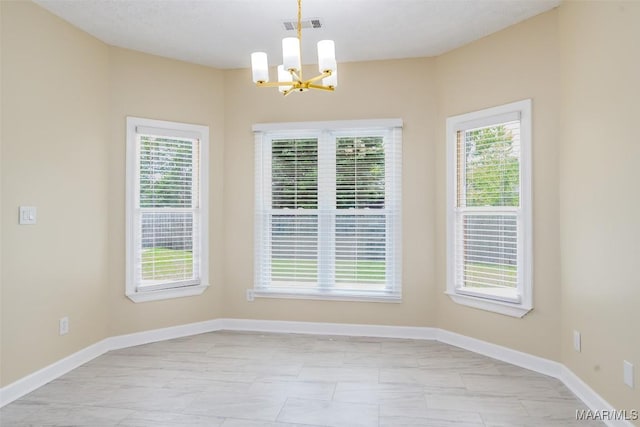 2224 Halcyon Blvd, Montgomery, AL 36117 - unfurnished dining area featuring a chandelier, baseboards, and healthy amount of natural light