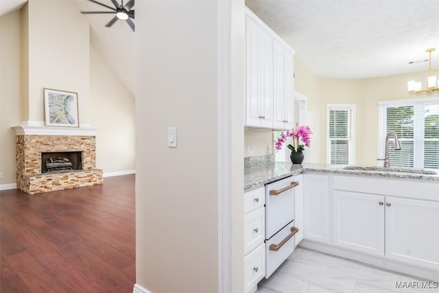 2224 Halcyon Blvd, Montgomery, AL 36117 - kitchen featuring a sink, light stone countertops, a ceiling fan, dishwasher, and white cabinets