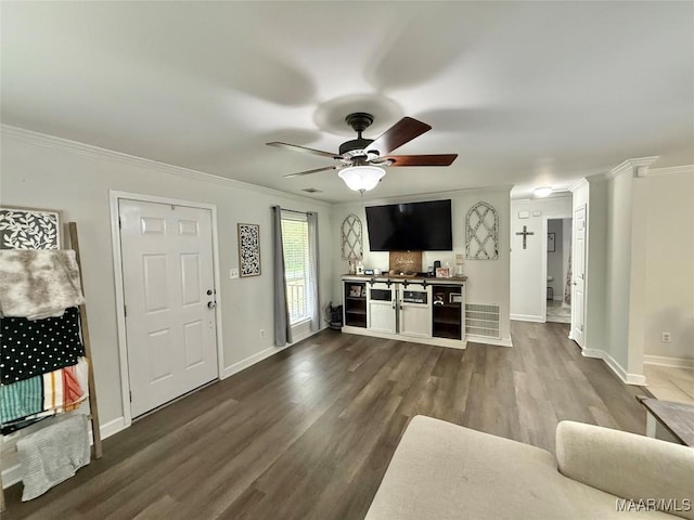 419 County Road 16, Valley Grande, AL 36701 - living area featuring ornamental molding, dark wood finished floors, a ceiling fan, and baseboards