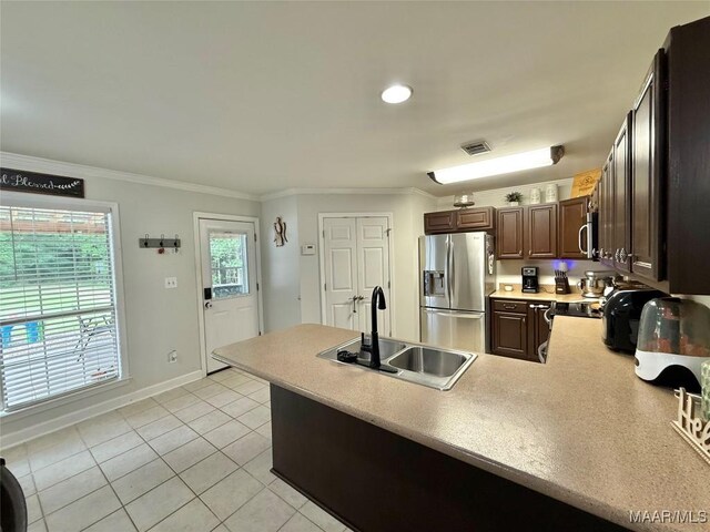 419 County Road 16, Valley Grande, AL 36701 - kitchen featuring appliances with stainless steel finishes, a sink, ornamental molding, a peninsula, and light tile patterned flooring
