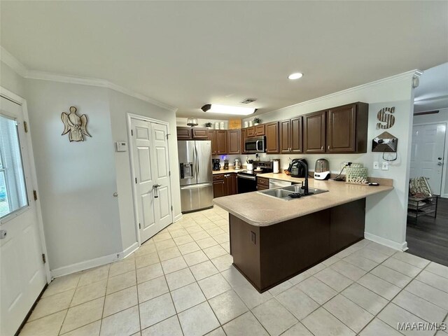 419 County Road 16, Valley Grande, AL 36701 - kitchen featuring stainless steel appliances, a sink, ornamental molding, light countertops, and a peninsula