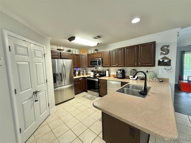 419 County Road 16, Valley Grande, AL 36701 - kitchen with stainless steel appliances, a sink, a peninsula, light countertops, and ornamental molding
