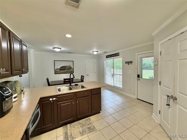 419 County Road 16, Valley Grande, AL 36701 - kitchen featuring a sink, a peninsula, light tile patterned floors, crown molding, and dark brown cabinets