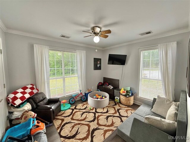419 County Road 16, Valley Grande, AL 36701 - living room featuring crown molding, ceiling fan, and wood finished floors