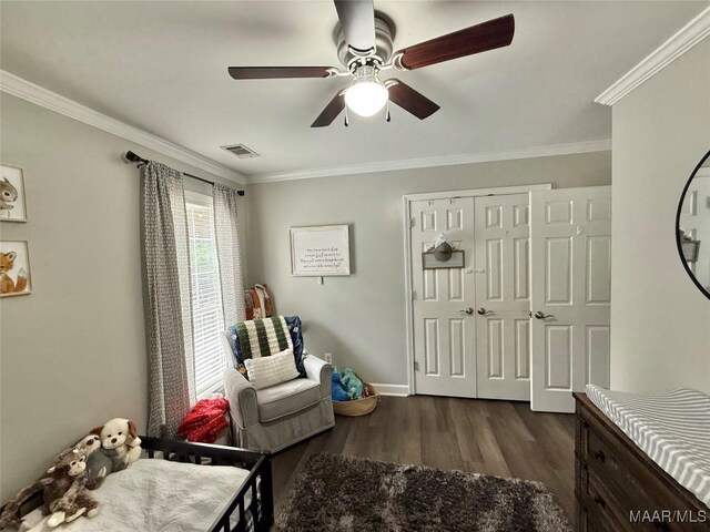 419 County Road 16, Valley Grande, AL 36701 - bedroom with crown molding, dark wood finished floors, a ceiling fan, baseboards, and a closet