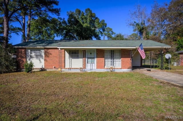 205 9th Ave, Selma, AL 36701 - single story home featuring a front lawn, concrete driveway, brick siding, and an attached carport