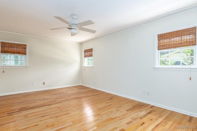 2527 Hermitage Dr, Montgomery, AL 36111 - spare room featuring light wood finished floors, baseboards, ceiling fan, and ornamental molding
