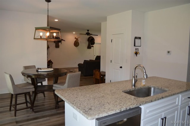7330 Butler Mill Rd, Ramer, AL 36069 - kitchen with a sink, dishwasher, dark wood-style floors, light stone countertops, and recessed lighting