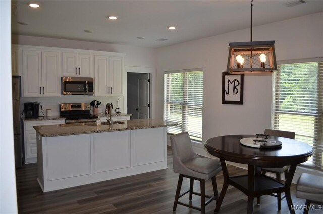 7330 Butler Mill Rd, Ramer, AL 36069 - kitchen featuring stainless steel appliances, tasteful backsplash, white cabinets, dark stone counters, and recessed lighting