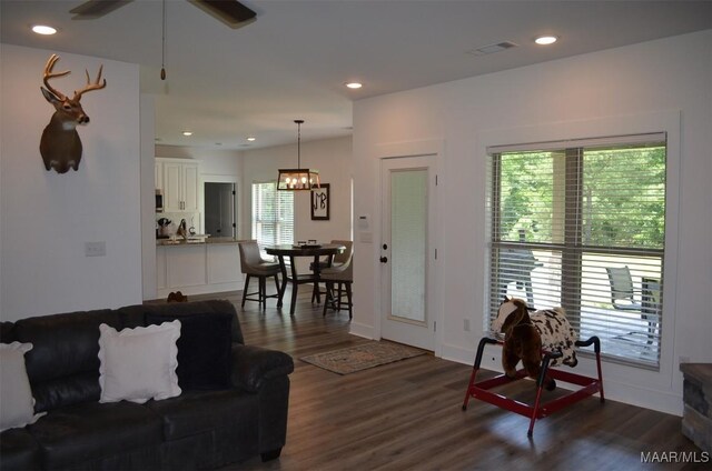 7330 Butler Mill Rd, Ramer, AL 36069 - living room featuring dark wood-style flooring, baseboards, ceiling fan, recessed lighting, and a chandelier