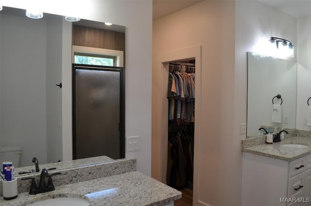 7330 Butler Mill Rd, Ramer, AL 36069 - full bath featuring a spacious closet, vanity, a walk in shower, toilet, and wood finished floors