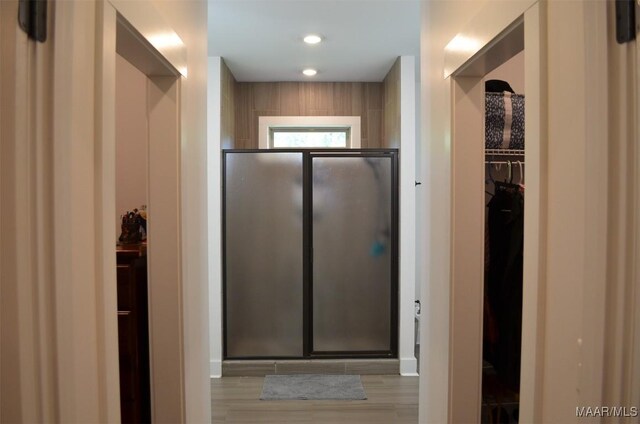 7330 Butler Mill Rd, Ramer, AL 36069 - full bathroom with a shower stall, a walk in closet, and wood finished floors