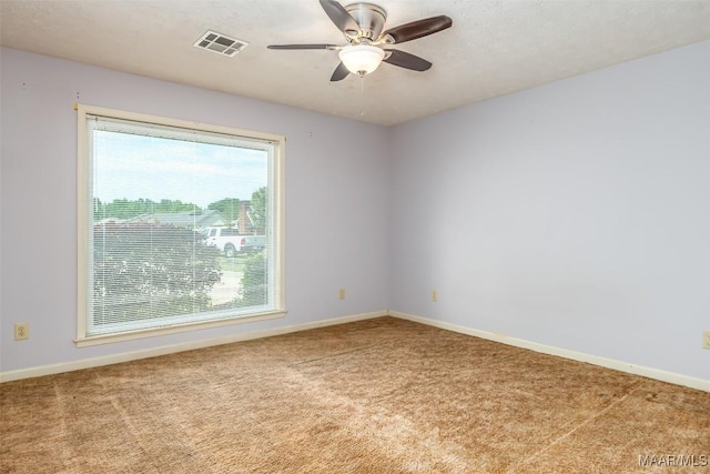 100 Duck Cv, Elmore, AL 36025 - carpeted empty room featuring plenty of natural light, baseboards, and a ceiling fan