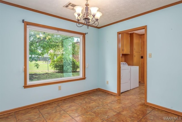100 Duck Cv, Elmore, AL 36025 - unfurnished room featuring washing machine and clothes dryer, a chandelier, baseboards, ornamental molding, and a textured ceiling