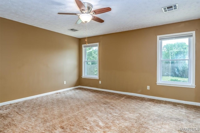 100 Duck Cv, Elmore, AL 36025 - carpeted empty room with a ceiling fan, baseboards, and a textured ceiling