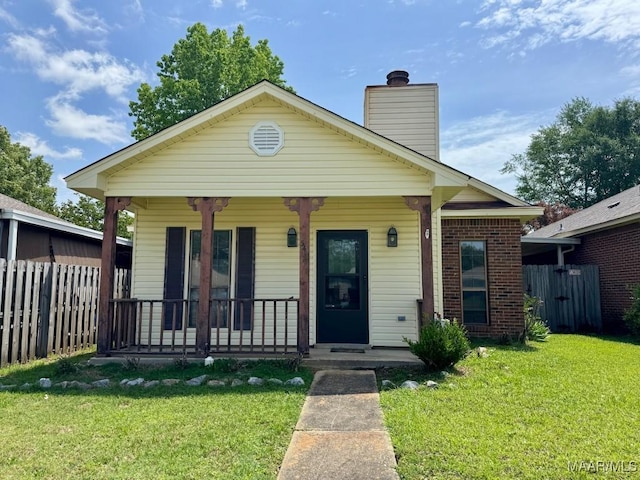 544 Sheila Blvd, Prattville, AL 36066 - view of front facade with covered porch, a chimney, and brick siding