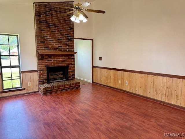 544 Sheila Blvd, Prattville, AL 36066 - unfurnished living room featuring wood finished floors, a wainscoted wall, healthy amount of natural light, a ceiling fan, and wood walls