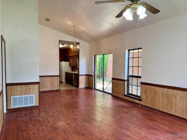 544 Sheila Blvd, Prattville, AL 36066 - empty room with a wainscoted wall, dark wood finished floors, wood walls, ceiling fan, and a chandelier