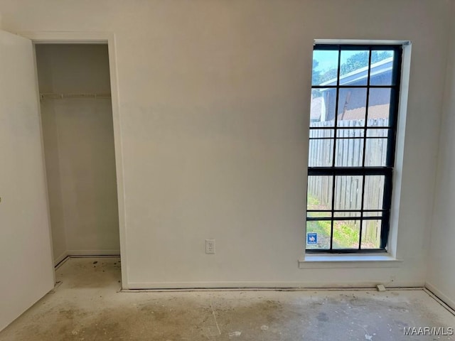 544 Sheila Blvd, Prattville, AL 36066 - unfurnished bedroom featuring a walk in closet, a closet, and baseboards