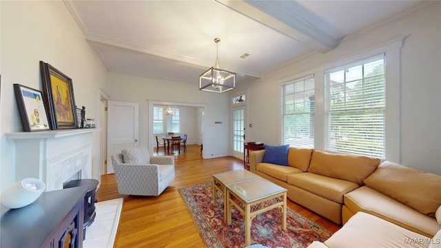356 Cloverdale Rd, Montgomery, AL 36104 - living area featuring light wood finished floors, beam ceiling, a chandelier, ornamental molding, and a fireplace