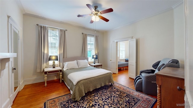 356 Cloverdale Rd, Montgomery, AL 36104 - bedroom featuring light wood-style floors, crown molding, baseboards, and a ceiling fan