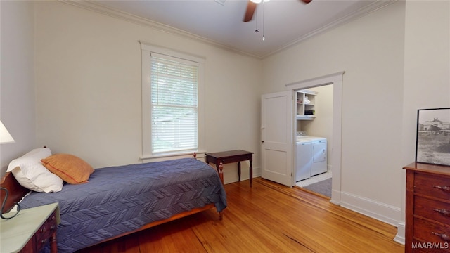356 Cloverdale Rd, Montgomery, AL 36104 - bedroom featuring light wood finished floors, washing machine and dryer, ornamental molding, baseboards, and a ceiling fan