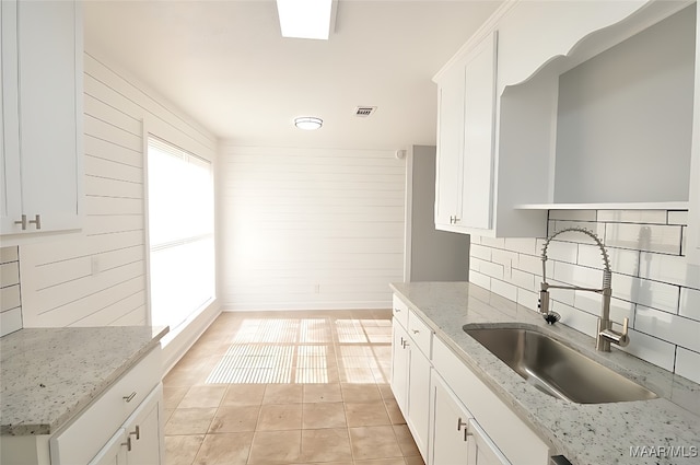 445 Durden Rd, Prattville, AL 36067 - kitchen with a sink, backsplash, light tile patterned floors, and white cabinets