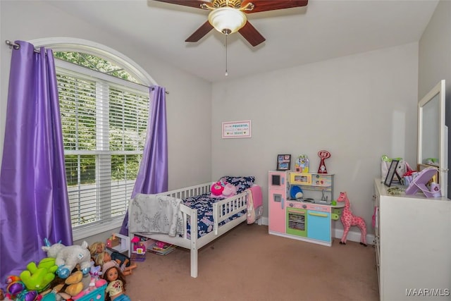 bedroom with carpet floors, ceiling fan, and baseboards