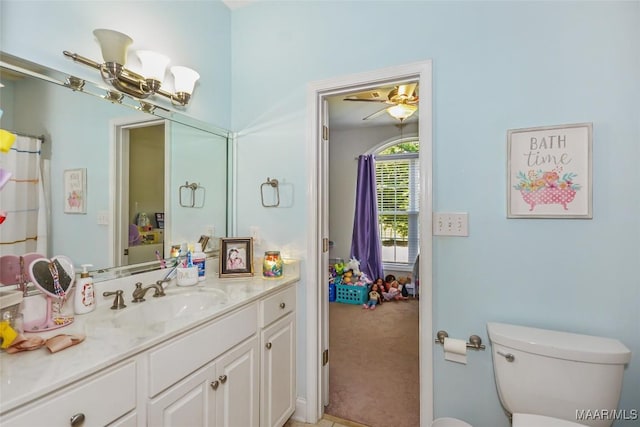 full bath featuring vanity and toilet