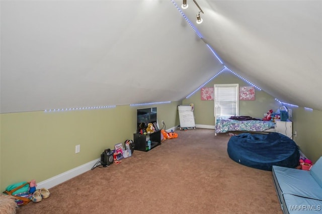 rec room with vaulted ceiling, carpet floors, and baseboards
