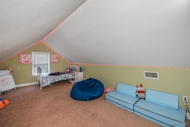 bedroom featuring carpet floors, lofted ceiling, and baseboards