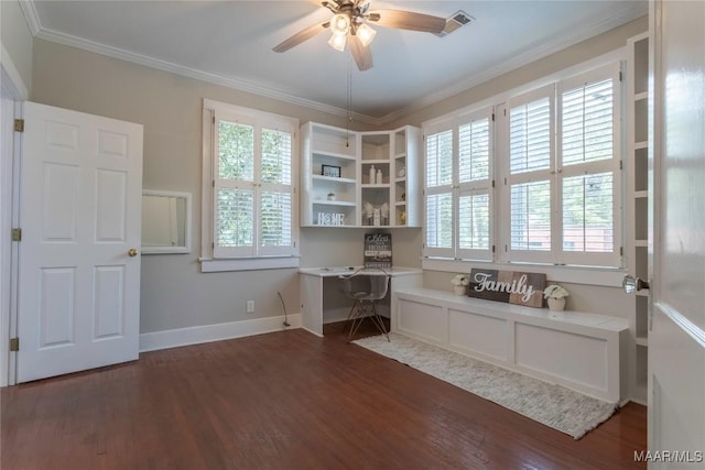 office area featuring built in desk, a ceiling fan, wood finished floors, healthy amount of natural light, and ornamental molding
