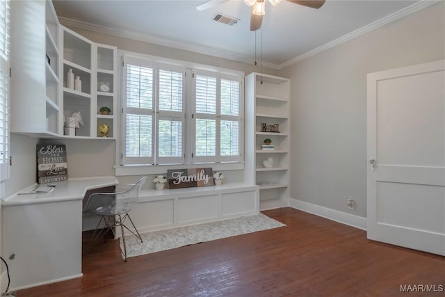 home office featuring dark wood-style flooring, ornamental molding, a ceiling fan, and baseboards