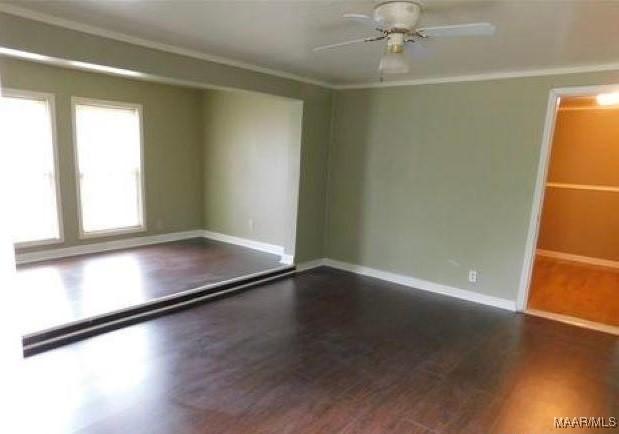 4097 Narrow Lane Rd, Montgomery, AL 36111 - empty room with dark wood-style floors, a ceiling fan, baseboards, and ornamental molding