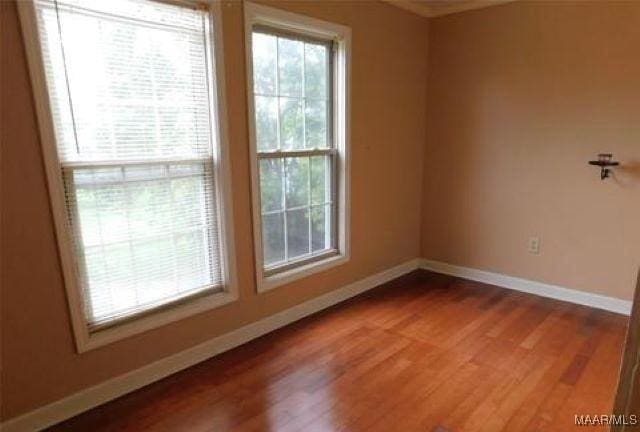 4097 Narrow Lane Rd, Montgomery, AL 36111 - spare room with baseboards and wood finished floors