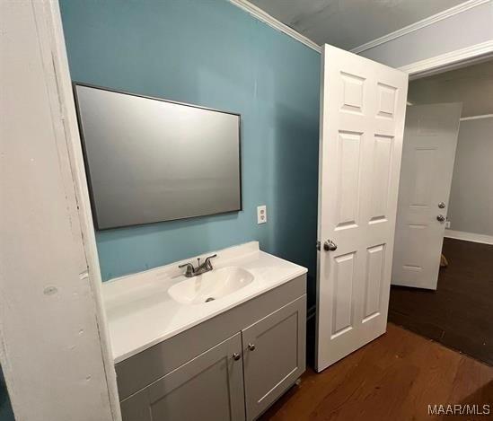 4097 Narrow Lane Rd, Montgomery, AL 36111 - bathroom featuring wood finished floors, ornamental molding, and vanity