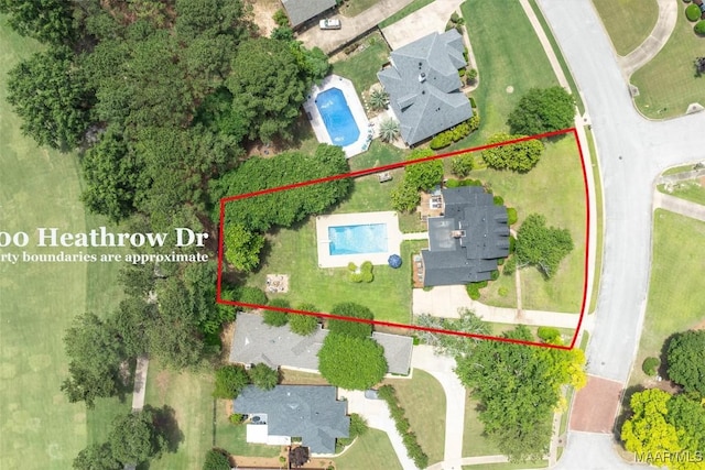 aerial overview of property's location featuring a pool area and property parcel outlined