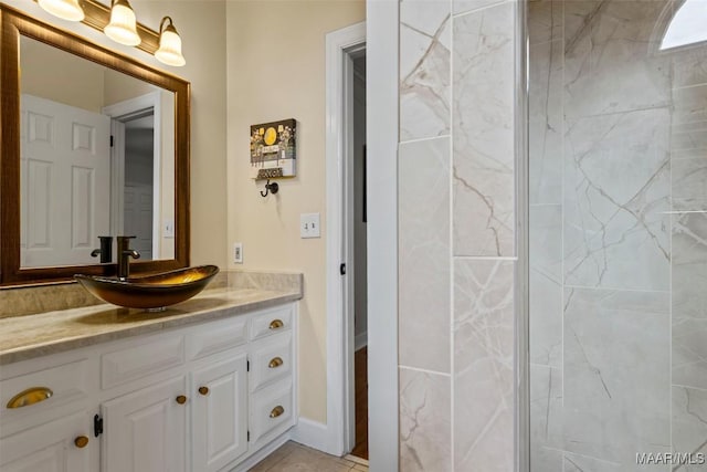 bathroom with vanity and tile patterned floors