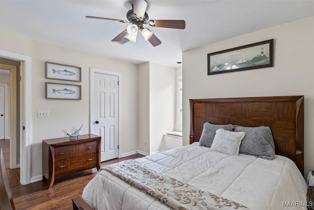 bedroom with dark wood finished floors, baseboards, and a ceiling fan