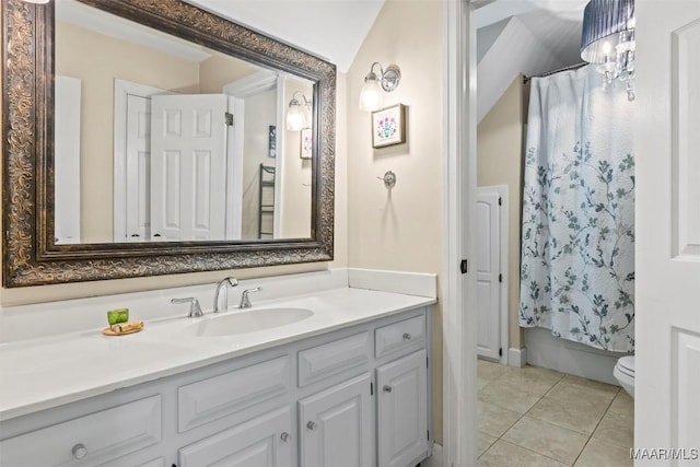 full bathroom with vanity, toilet, tile patterned flooring, and shower / bath combo with shower curtain