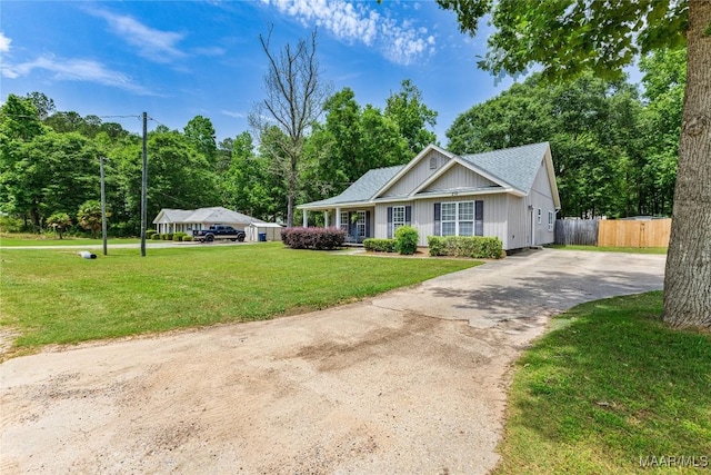 ranch-style house with asphalt driveway
