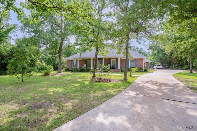 705 Yellowstone Dr, Prattville, AL 36067 - ranch-style home with a front yard, brick siding, and driveway