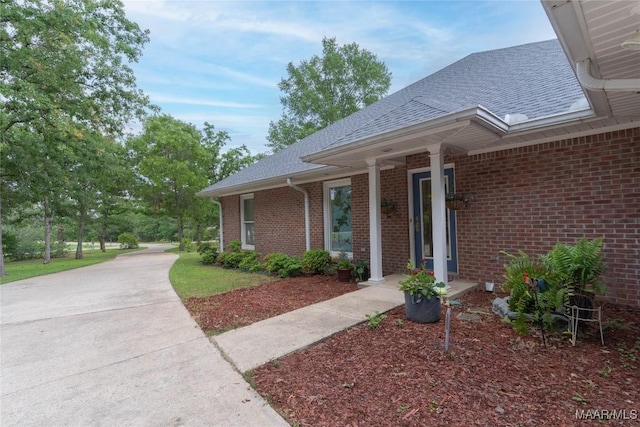 705 Yellowstone Dr, Prattville, AL 36067 - view of side of home featuring brick siding and roof with shingles