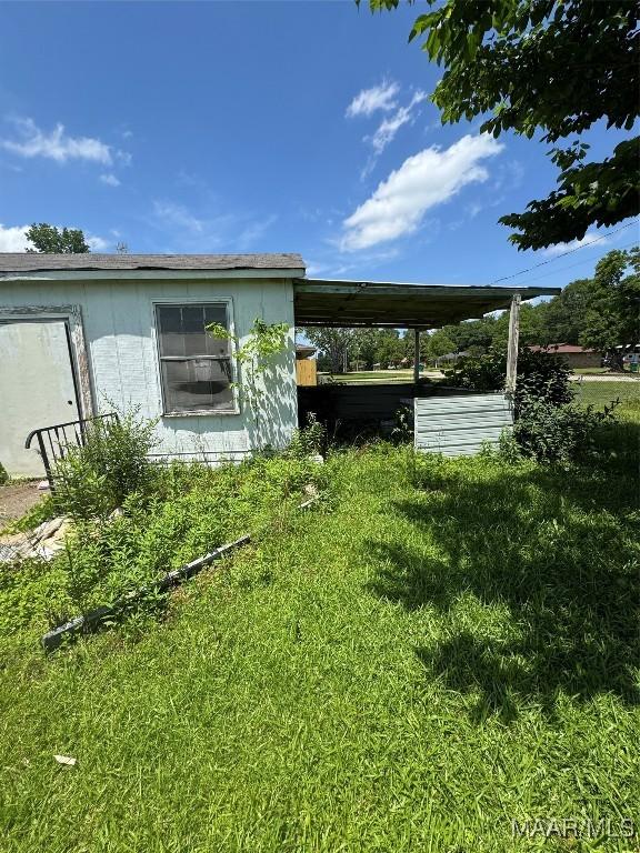 view of property exterior featuring a lawn