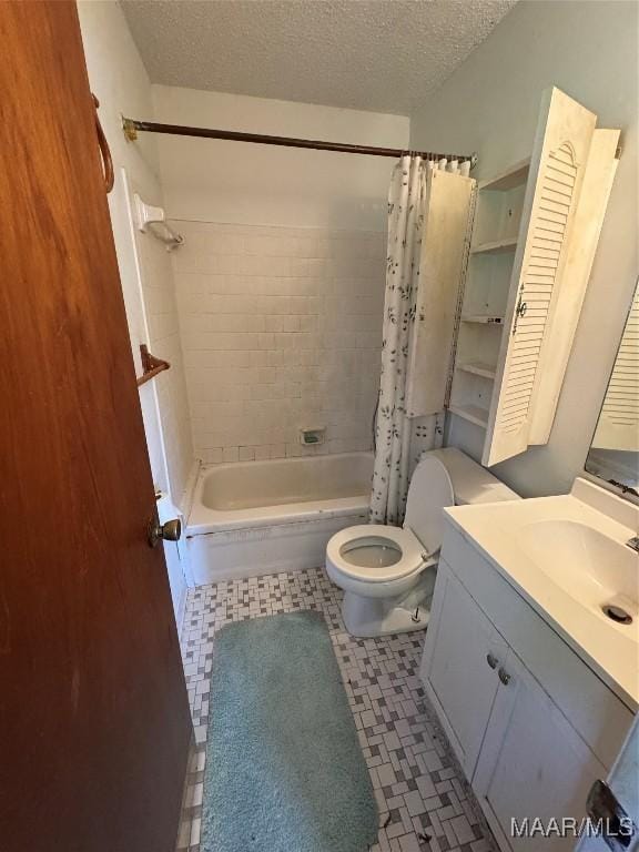 bathroom featuring a textured ceiling, toilet, shower / bath combo with shower curtain, tile patterned floors, and vanity