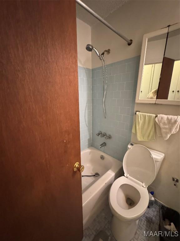 full bath with shower / bath combination and toilet