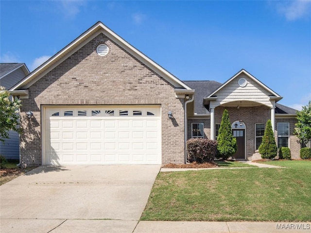 6812 Overview Ct, Montgomery, AL 36117 - view of front facade featuring concrete driveway, a front lawn, brick siding, and an attached garage
