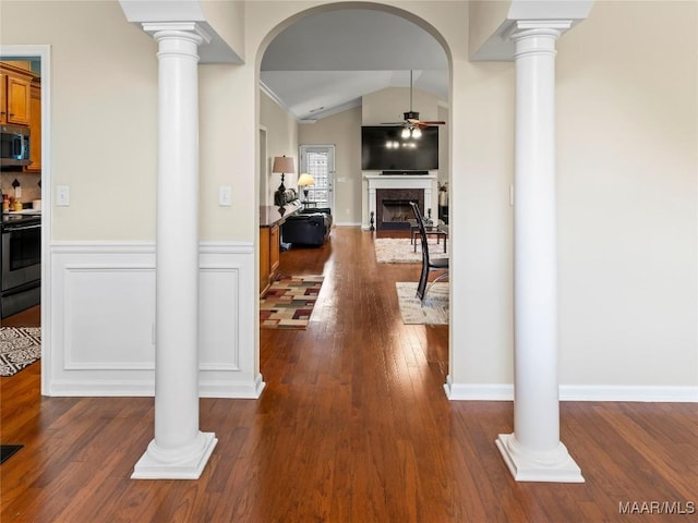 6812 Overview Ct, Montgomery, AL 36117 - corridor with lofted ceiling, dark wood-style flooring, ornate columns, arched walkways, and wainscoting
