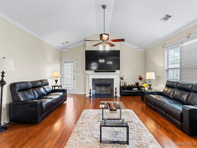 6812 Overview Ct, Montgomery, AL 36117 - living area featuring a ceiling fan, wood finished floors, vaulted ceiling, a premium fireplace, and ornamental molding